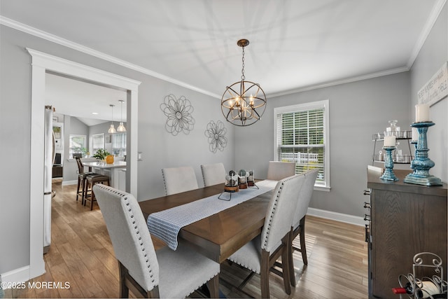 36 Sally St, Howell, NJ 07731 - dining space with a chandelier, crown molding, and light wood-style floors