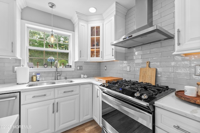 36 Sally St, Howell, NJ 07731 - kitchen with wall chimney exhaust hood, appliances with stainless steel finishes, backsplash, white cabinets, and light countertops