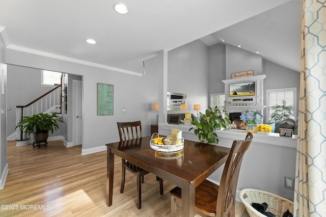 36 Sally St, Howell, NJ 07731 - dining room featuring recessed lighting, a fireplace, stairway, light wood finished floors, and lofted ceiling