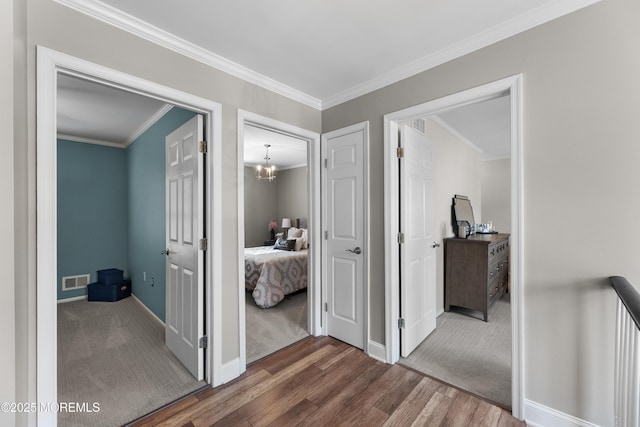 36 Sally St, Howell, NJ 07731 - hall featuring wood finished floors, crown molding, and a chandelier