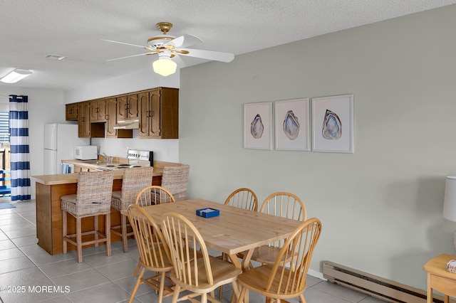 3100 Rte 35 Unit 6, Lavallette, NJ 08735 - dining area featuring a baseboard heating unit, light tile patterned flooring, ceiling fan, and a textured ceiling