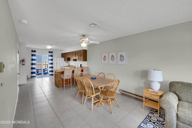 3100 Rte 35 Unit 6, Lavallette, NJ 08735 - dining room with a ceiling fan, a baseboard heating unit, light tile patterned floors, and a textured ceiling