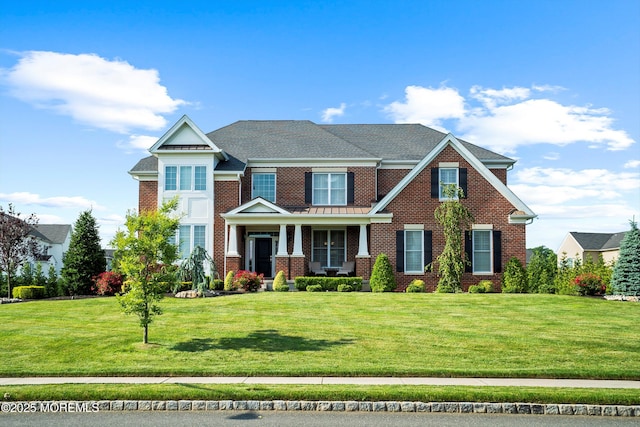11 Potomac Ct, Freehold, NJ 07728 - view of front of home featuring brick siding, a front yard, and a porch