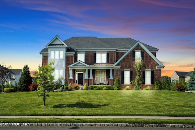 11 Potomac Ct, Freehold, NJ 07728 - view of front of property featuring brick siding, a front lawn, and a porch