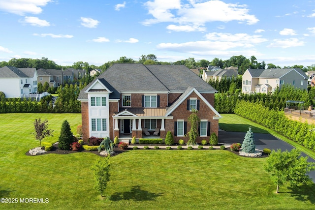 11 Potomac Ct, Freehold, NJ 07728 - view of front of home featuring a residential view, a porch, brick siding, and a front lawn