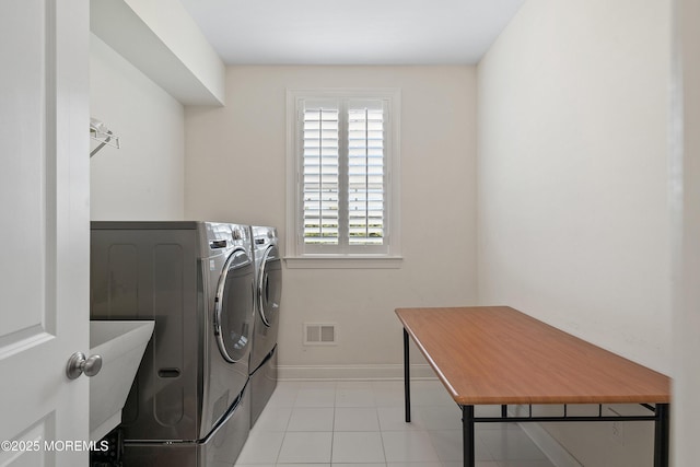 11 Potomac Ct, Freehold, NJ 07728 - laundry room featuring washing machine and clothes dryer and light tile patterned floors