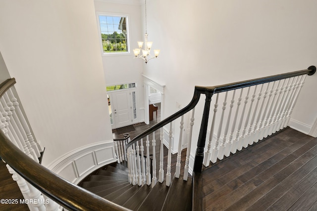 11 Potomac Ct, Freehold, NJ 07728 - staircase with a chandelier, a high ceiling, and wood finished floors