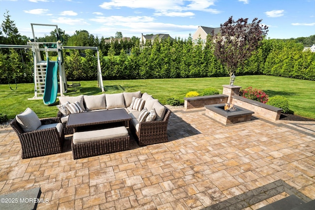 11 Potomac Ct, Freehold, NJ 07728 - view of patio featuring a playground and an outdoor living space with a fire pit