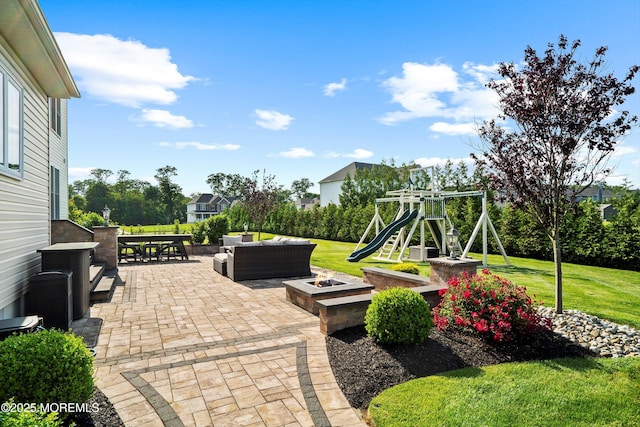 11 Potomac Ct, Freehold, NJ 07728 - view of patio with an outdoor living space with a fire pit, a playground, and outdoor dining space