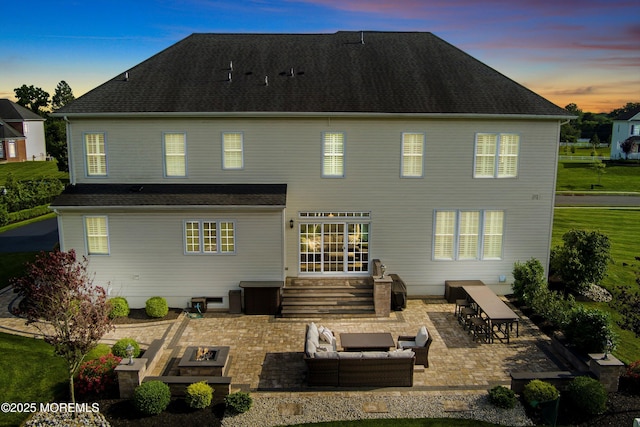 11 Potomac Ct, Freehold, NJ 07728 - back of house at dusk with an outdoor living space with a fire pit, a patio area, and entry steps