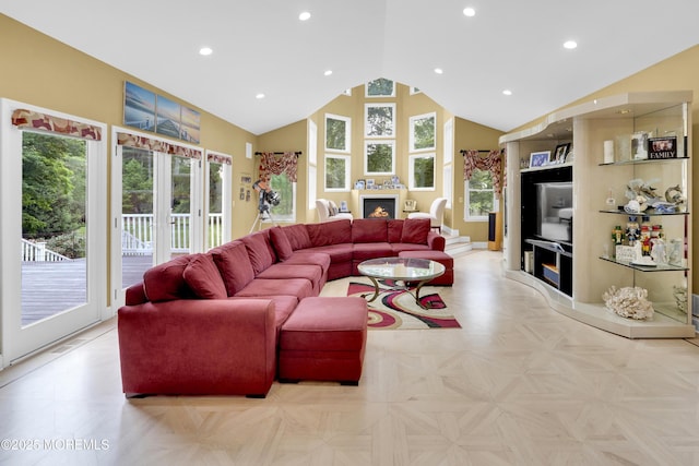 1609 Revere Ln, Wall, NJ 07753 - living area with a lit fireplace, plenty of natural light, high vaulted ceiling, and recessed lighting