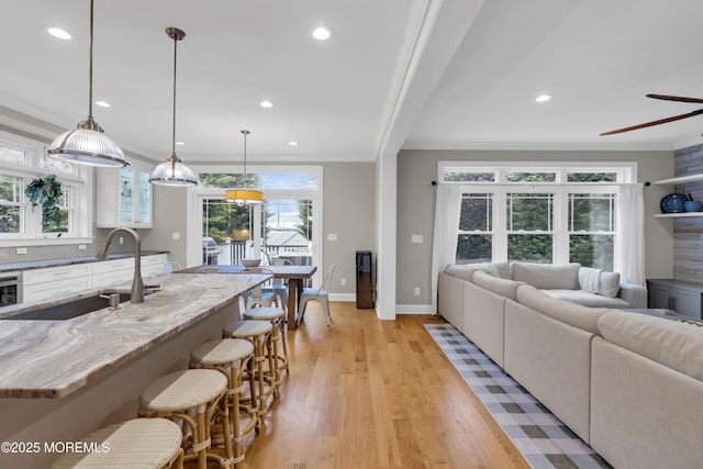 209 Sanborn Ave, Point Pleasant Beach, NJ 08742 - living room featuring crown molding, recessed lighting, light wood-type flooring, and a ceiling fan