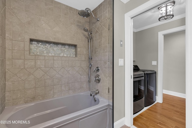 209 Sanborn Ave, Point Pleasant Beach, NJ 08742 - full bathroom featuring washing machine and clothes dryer, crown molding, tub / shower combination, and wood finished floors