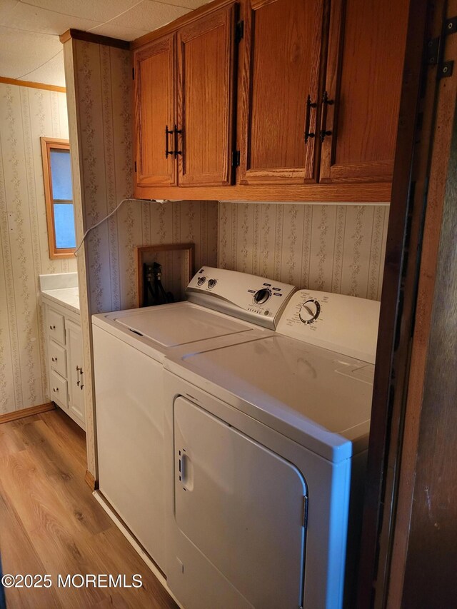 39 Antonia Dr, Jackson, NJ 08527 - laundry room with wallpapered walls, washing machine and clothes dryer, light wood-style flooring, and cabinet space