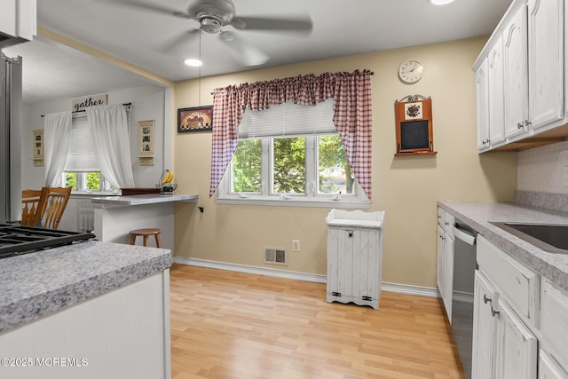 301 Spruce Dr, Brick, NJ 08723 - kitchen featuring ceiling fan, light wood finished floors, white cabinets, light countertops, and recessed lighting