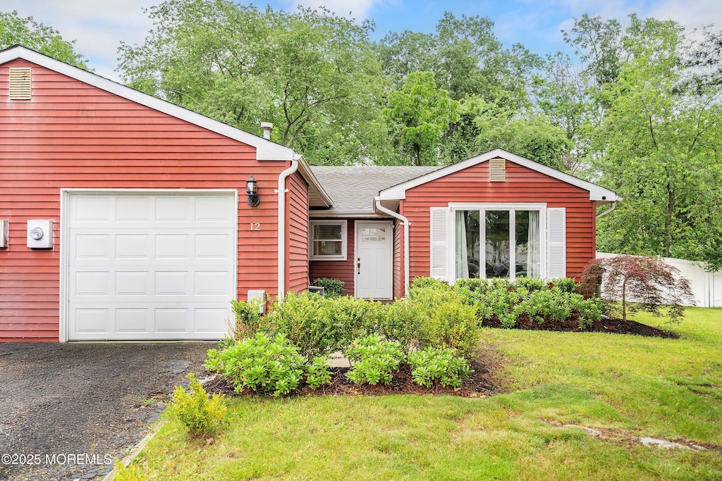12 Briarcliff Ct, Freehold, NJ 07728 - view of front of house with a front yard, a garage, and driveway
