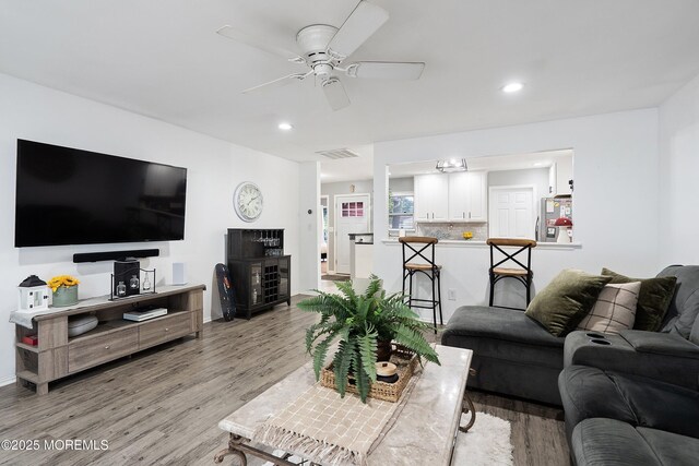 12 Briarcliff Ct, Freehold, NJ 07728 - living area with light wood finished floors, a ceiling fan, and recessed lighting