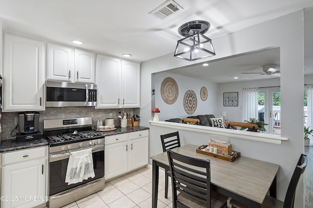 12 Briarcliff Ct, Freehold, NJ 07728 - kitchen with stainless steel appliances, backsplash, light tile patterned floors, white cabinets, and recessed lighting