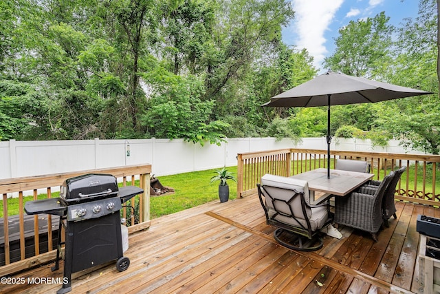 12 Briarcliff Ct, Freehold, NJ 07728 - wooden deck with grilling area, outdoor dining area, and a fenced backyard
