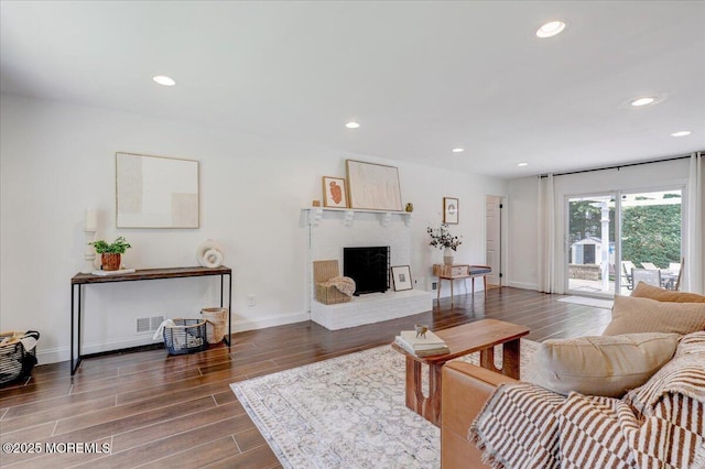 12 Neal Dr, Manalapan, NJ 07726 - living area featuring wood finished floors, a fireplace, and recessed lighting
