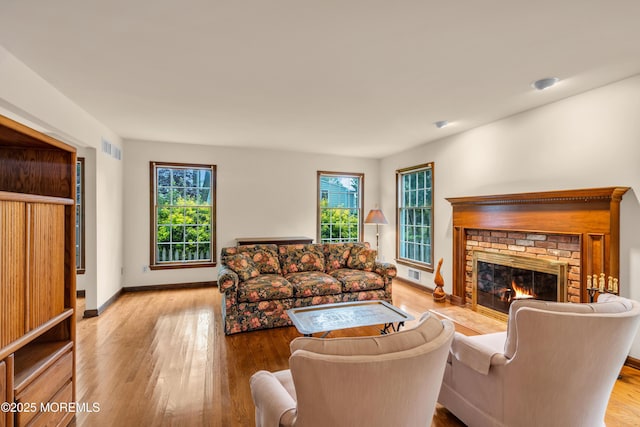 406 Bell Pl, Sea Girt, NJ 08750 - living area with plenty of natural light, wood finished floors, and a fireplace