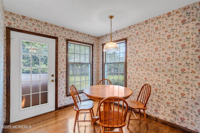 406 Bell Pl, Sea Girt, NJ 08750 - dining room with wallpapered walls and light wood finished floors