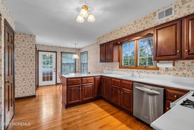 406 Bell Pl, Sea Girt, NJ 08750 - kitchen with dishwasher, wallpapered walls, healthy amount of natural light, a peninsula, and light wood finished floors
