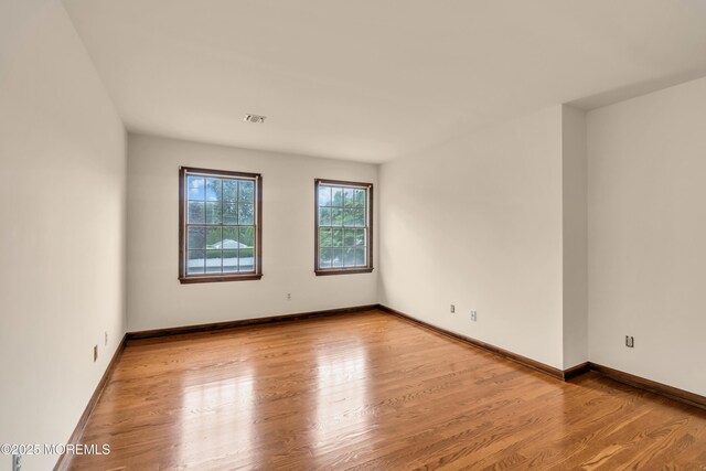 406 Bell Pl, Sea Girt, NJ 08750 - spare room featuring wood finished floors and baseboards