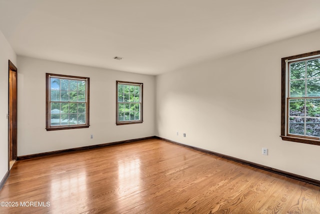406 Bell Pl, Sea Girt, NJ 08750 - spare room with healthy amount of natural light and light wood finished floors