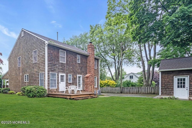 406 Bell Pl, Sea Girt, NJ 08750 - rear view of property with a chimney, a wooden deck, and roof with shingles