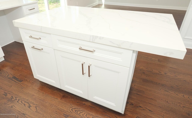 910 Malden Dr, Cliffwood, NJ 07735 - detailed view of light stone counters, white cabinets, and dark wood-type flooring