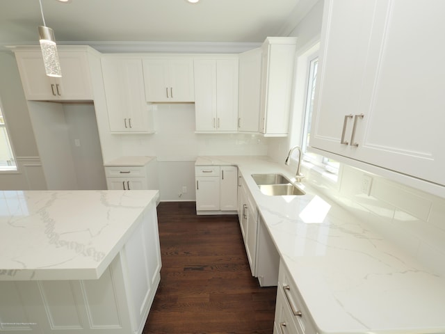 910 Malden Dr, Cliffwood, NJ 07735 - kitchen with dark wood-type flooring, light stone counters, white cabinets, pendant lighting, and crown molding