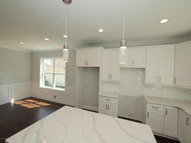 910 Malden Dr, Cliffwood, NJ 07735 - kitchen with ornamental molding, white cabinetry, dark wood-style flooring, recessed lighting, and light stone countertops