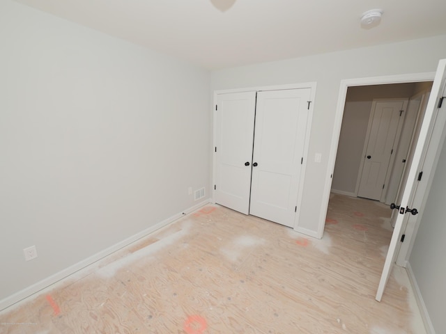 910 Malden Dr, Cliffwood, NJ 07735 - unfurnished bedroom with baseboards and a closet