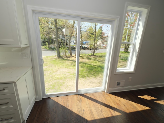 910 Malden Dr, Cliffwood, NJ 07735 - doorway to outside with healthy amount of natural light and dark wood-style floors