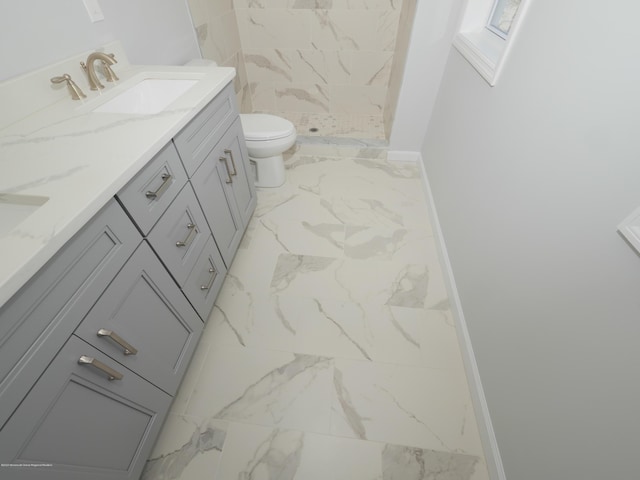 910 Malden Dr, Cliffwood, NJ 07735 - full bathroom with marble look tile flooring, double vanity, and a shower stall