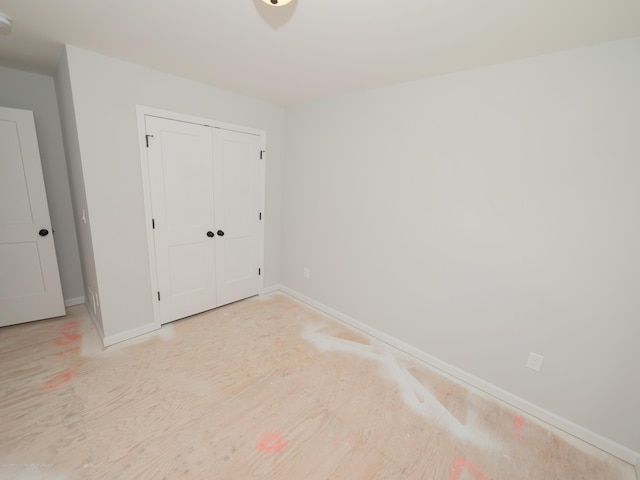 910 Malden Dr, Cliffwood, NJ 07735 - unfurnished bedroom with light wood-style flooring and a closet