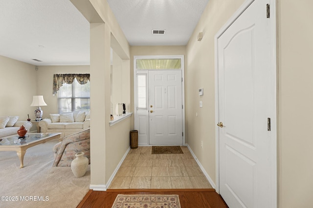 17 Evergreen Springs Dr, Lakewood, NJ 08701 - entryway with a textured ceiling and light wood-type flooring