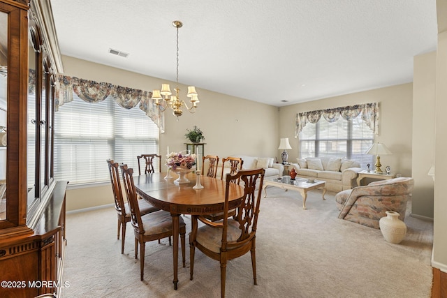 17 Evergreen Springs Dr, Lakewood, NJ 08701 - carpeted dining area with a chandelier and a textured ceiling