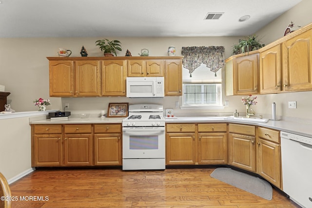 17 Evergreen Springs Dr, Lakewood, NJ 08701 - kitchen featuring white appliances, light wood-style flooring, and light countertops
