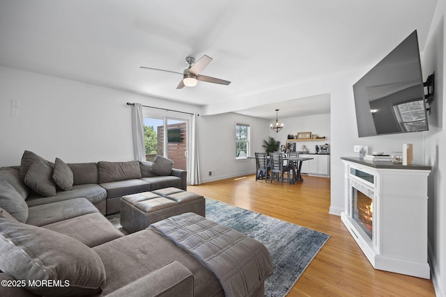 623 Park Ave, Port Monmouth, NJ 07758 - living area with a chandelier, light wood finished floors, and ceiling fan