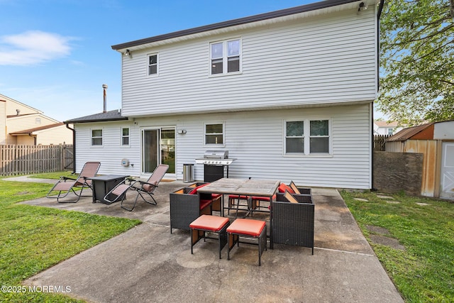 8 Mendon Dr, Howell, NJ 07731 - back of property with a storage unit, a patio, a fenced backyard, and outdoor dining area