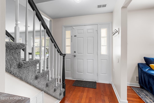 8 Mendon Dr, Howell, NJ 07731 - entryway with wood finished floors and stairs