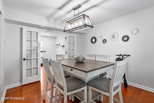 8 Mendon Dr, Howell, NJ 07731 - dining space with french doors, wood finished floors, and a chandelier