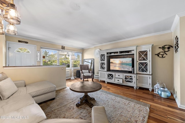 100 Seaview Ave Unit 6-5, Monmouth Beach, NJ 07750 - living room featuring wood finished floors, crown molding, and a baseboard radiator