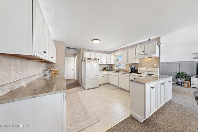 118 S Binnacle Dr, Little Egg Harbor, NJ 08087 - kitchen with white appliances, decorative backsplash, light stone counters, under cabinet range hood, and white cabinetry