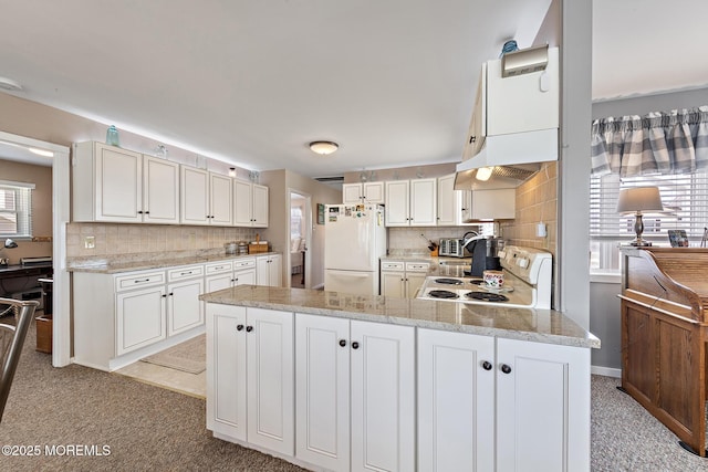 118 S Binnacle Dr, Little Egg Harbor, NJ 08087 - kitchen with white appliances, backsplash, a peninsula, and light colored carpet