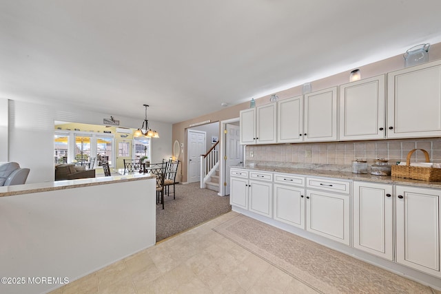 118 S Binnacle Dr, Little Egg Harbor, NJ 08087 - kitchen with tasteful backsplash, a chandelier, decorative light fixtures, and white cabinetry