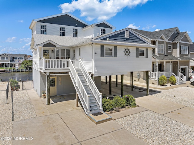 118 S Binnacle Dr, Little Egg Harbor, NJ 08087 - view of front facade featuring stairs, a carport, a residential view, and a porch