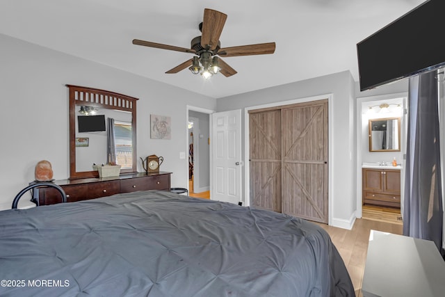 1506 Beverly Rd, Forked River, NJ 08731 - bedroom featuring light wood-style floors, a ceiling fan, connected bathroom, and a closet